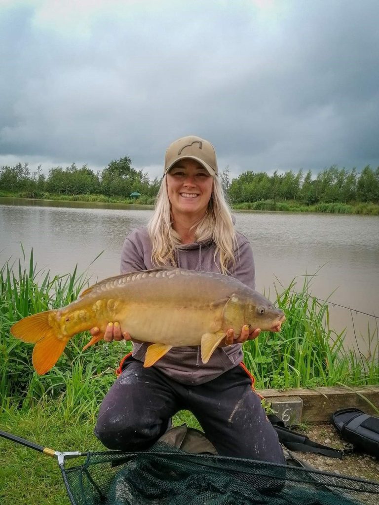 Get Fishing - Emma Harrison Fishing with a carp at a commercial fishery-2