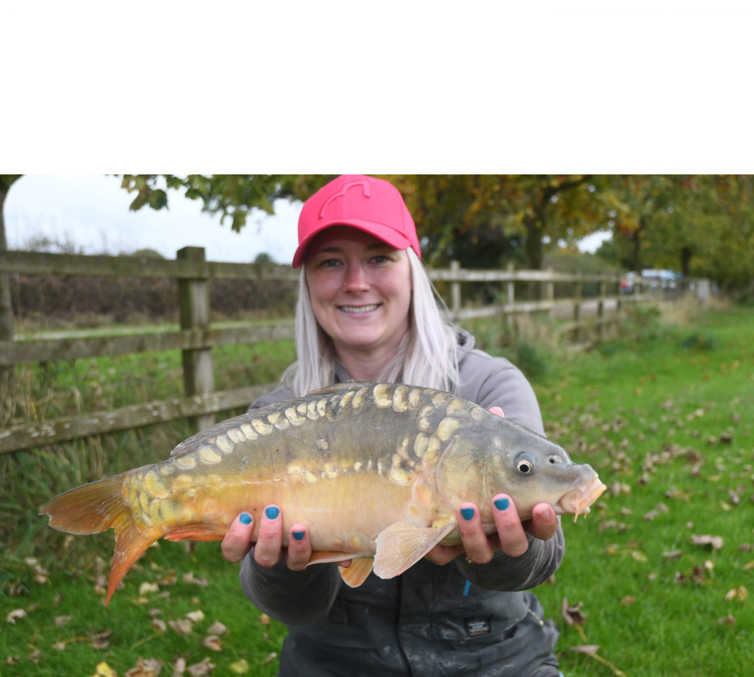 Get Fishing - Emma Harrison Fishing with a carp at a commercial fishery-7