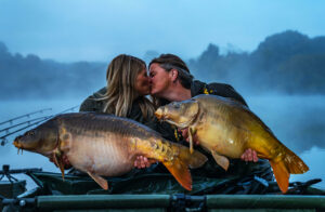 Lizette Beunders and Bianca Venema are pictured having a celebratory kiss in front of Lac de Madine in France, following their World Carp Classic victory in 2013.