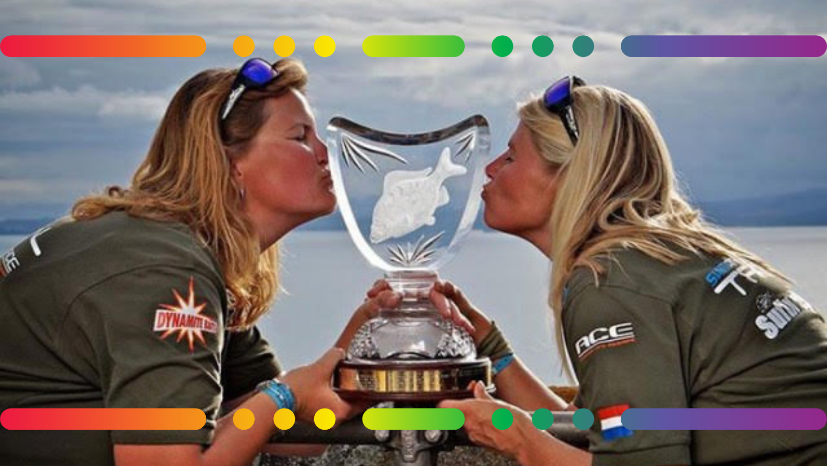 Lizette Beunders and Bianca Venema are pictured in front of a glistening Lac de Madine in France, kissing their historic engraved glass trophy for the World Carp Classic in 2013.