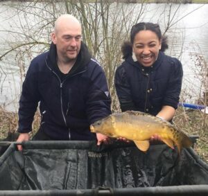 Get Fishing | Spring into Fishing - young person pring fishing on a pool with carp and a coach