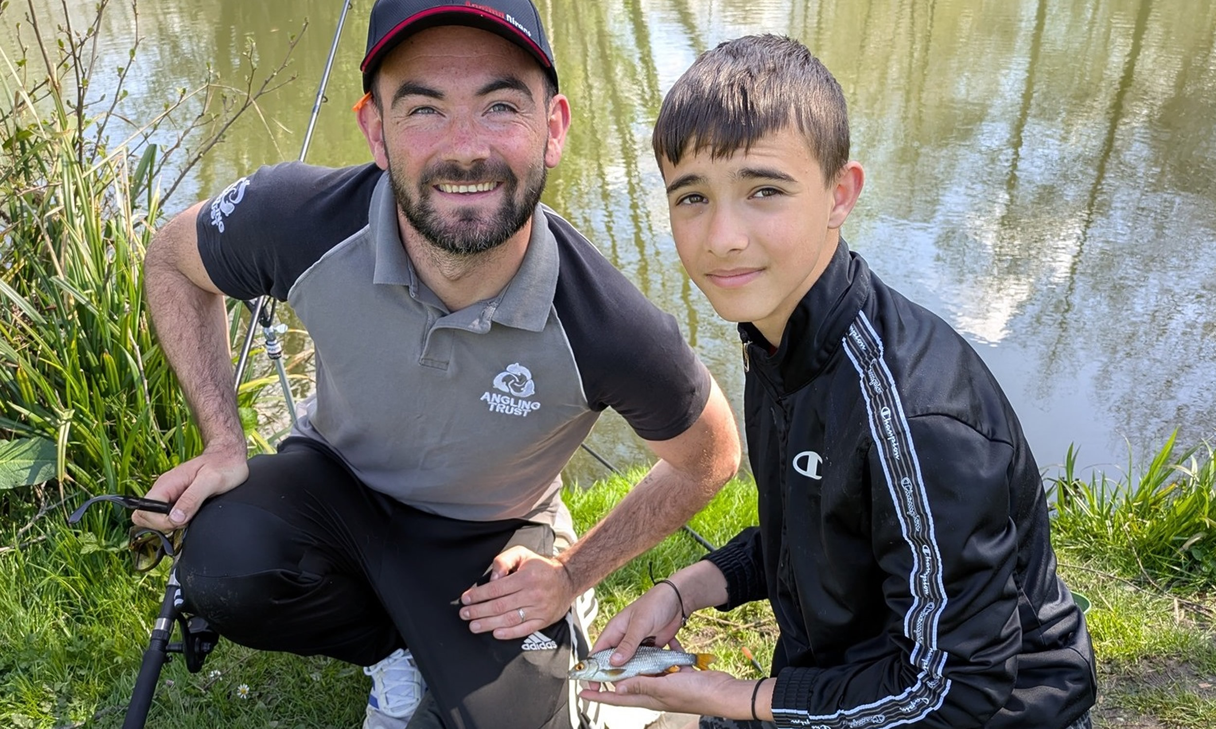Get Fishing | Jack helping a newcomer to learn to fish-header